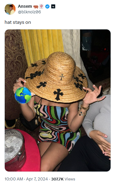 Ansem's tweet captioned 'hat stays on' showing the straw hat with cross patches being worn at a party
